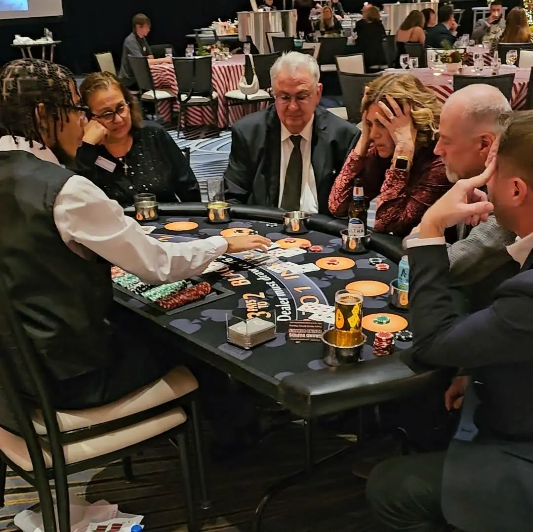 Guests enjoying a professionally hosted blackjack table